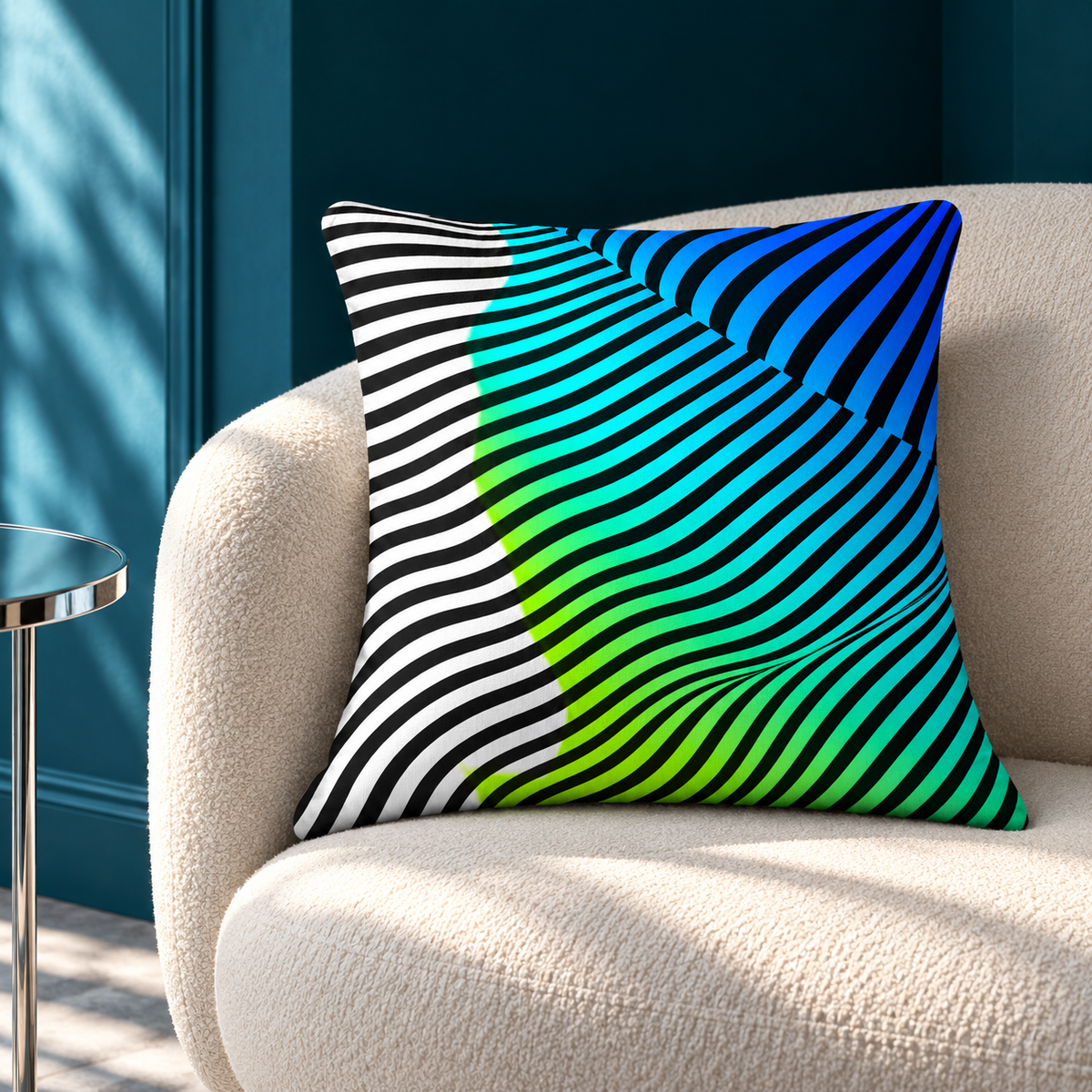 Moodwave pillow with curved black stripes, white, lime, cyan and blue on an ivory lounge chair against a petrol wall, lit by angled daylight.