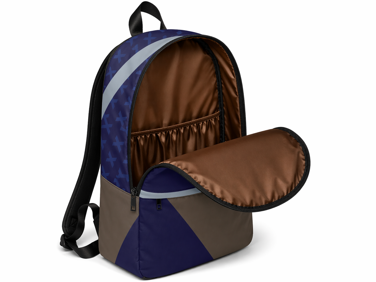 An open blue-and-gray geometric backpack showing its brown lining and interior pocket.