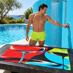 Man beside Liquid Society beach towel at a pool.