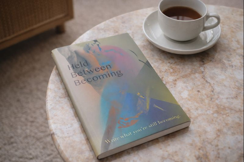 Held Between Becoming - Journal