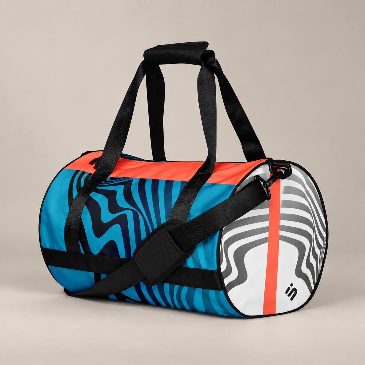 Hot Circuit gym duffle bag on a white background, showing blue wave artwork, coral trim, black straps, and a white striped end.