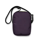 Plain purple back of the Velvet Detour crossbody bag with its black adjustable strap.