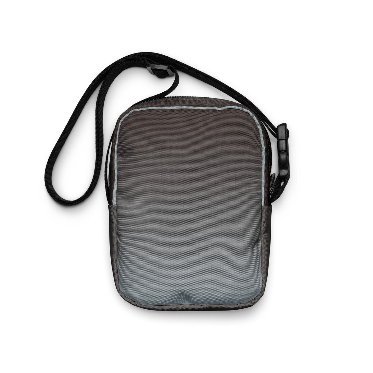Plain gray back of the Unruly crossbody bag with its black strap.