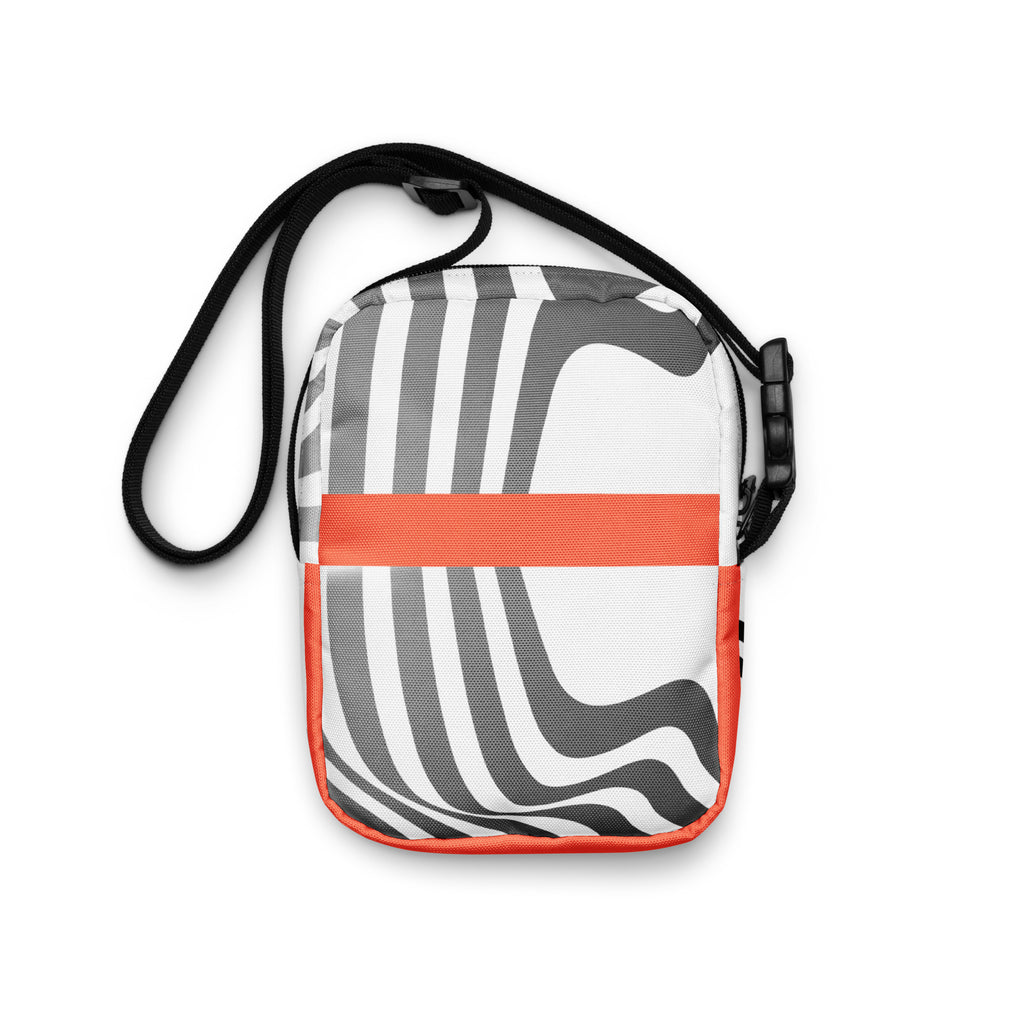 Rear view of the Wrong Turn crossbody bag with black-and-white curved stripes and an orange band.