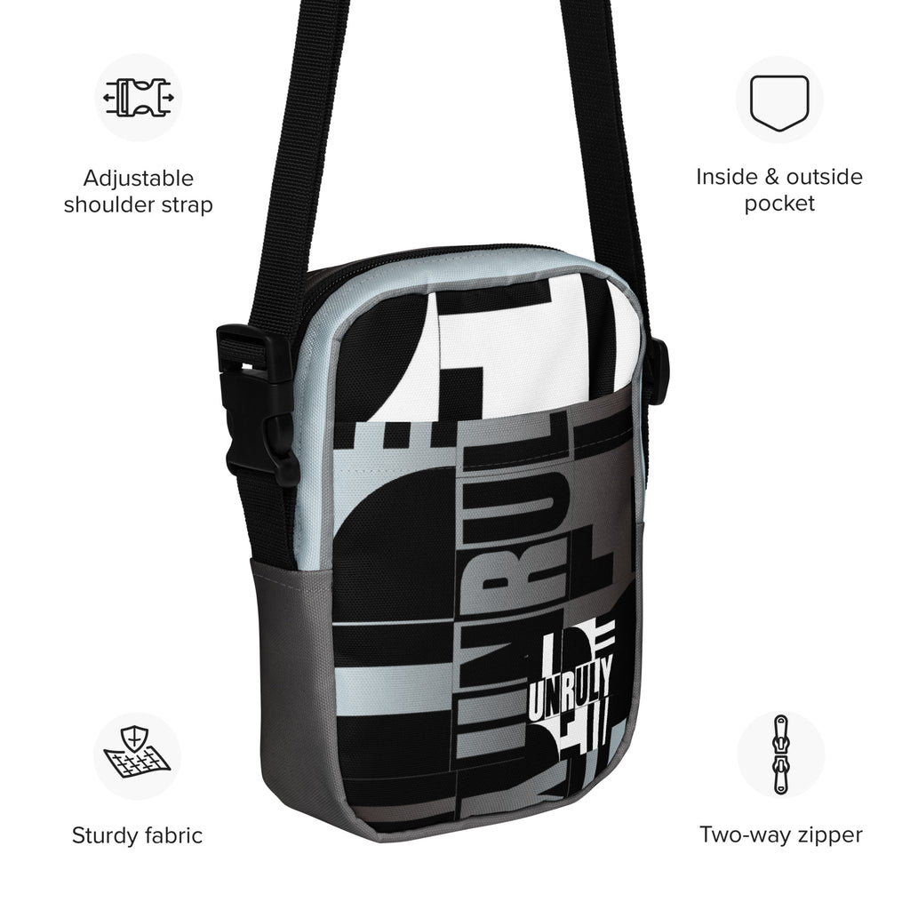Unruly crossbody bag with English callouts identifying its adjustable strap, pockets, fabric, and two-way zipper.