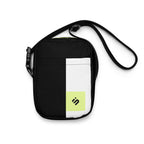 Front view of the Personal Baggage black crossbody bag with a white stripe and yellow-green monogram patch.