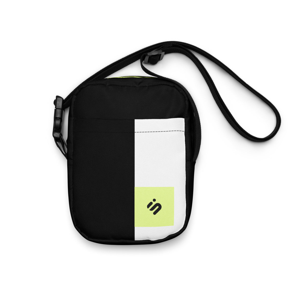 Front view of the Personal Baggage black crossbody bag with a white stripe and yellow-green monogram patch.