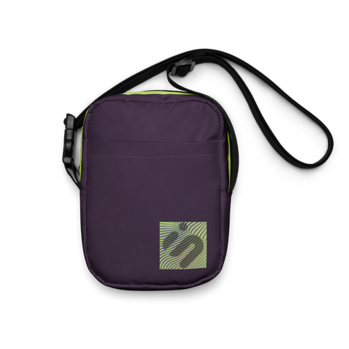 Front view of the purple Velvet Detour crossbody bag with a striped yellow-green monogram patch.