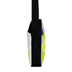 Narrow side view of the Personal Baggage bag with black, white, and yellow-green panels.