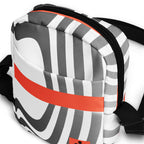 Close-up of the Wrong Turn bag's striped front pocket, horizontal orange band, and black zipper.