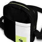 Close-up of the Personal Baggage bag's black front pocket, white stripe, and yellow-green zipper accent.