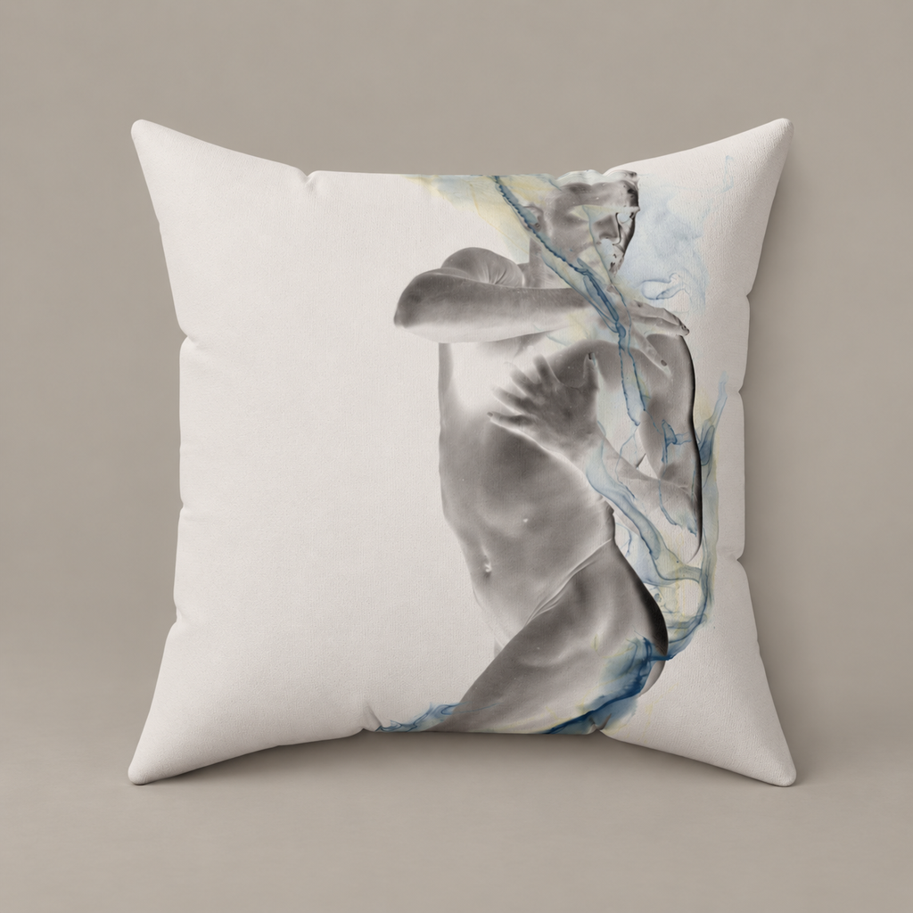 Smoke, Then Rise faux-suede pillow with a grayscale figure and blue watercolor lines on a warm greige studio surface.