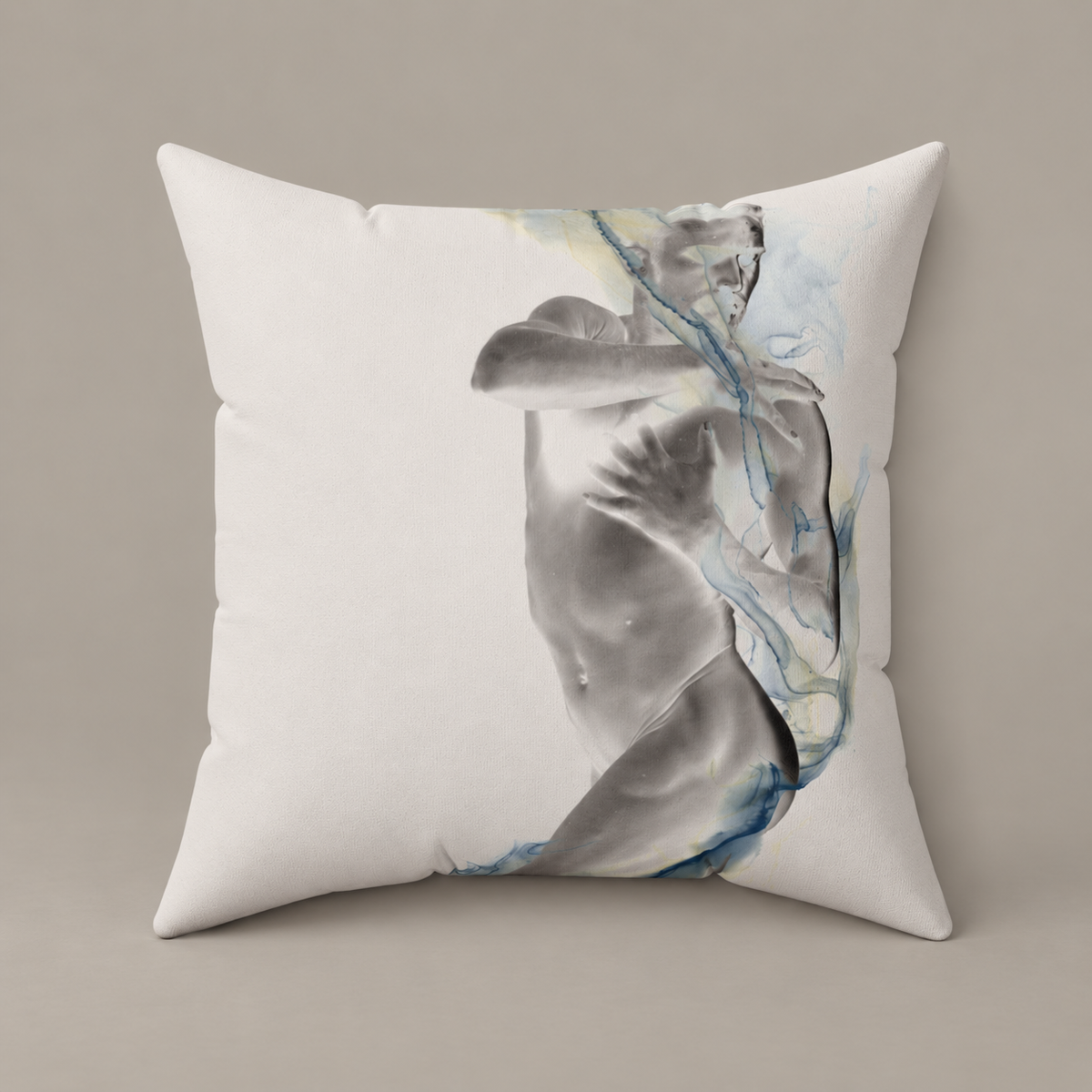Smoke, Then Rise faux-suede pillow with a grayscale figure and blue watercolor lines on a warm greige studio surface.