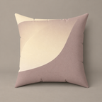 Subtle Seduction faux-suede pillow with a cream curved form against warm taupe on a greige studio surface.