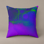 Toxic Glow-Up faux-suede pillow with blue, violet and vivid green abstract artwork on a warm greige studio surface.